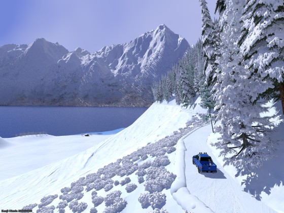 雪の山道を湖岸のシャレーへ向かうフォードF150ラプター