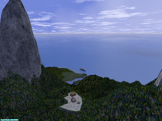島の上空から山小屋と海岸を見下ろす